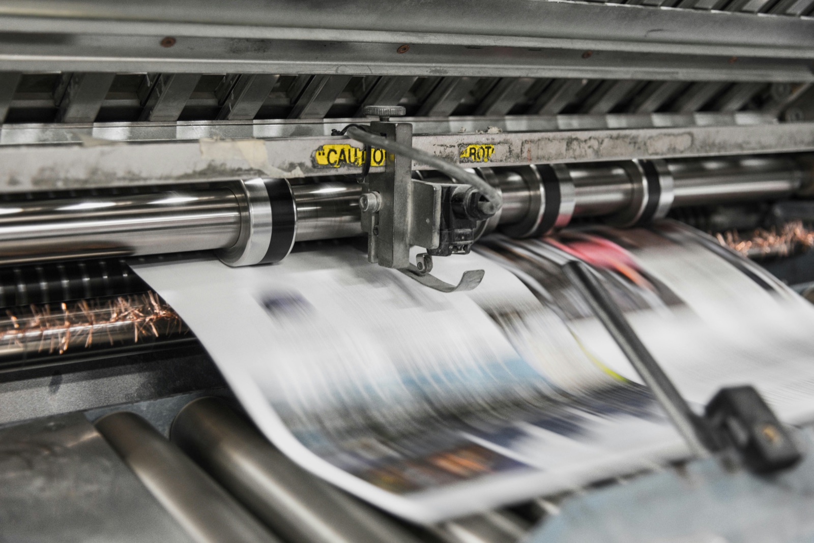 Industrial printing machine in motion for Incure CDM™ UV conveyor UV varnish and packaging cure