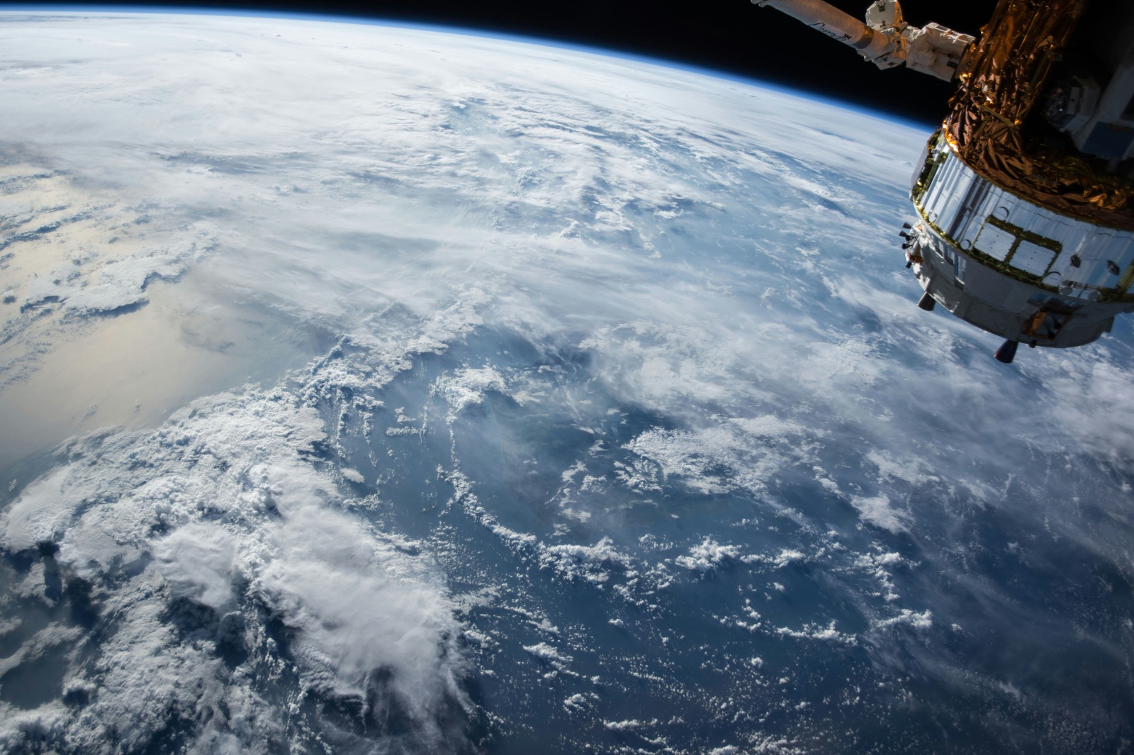 View of Earth from orbit with spacecraft module for Epo-Weld™ HTE high-temperature epoxy aerospace structural bonding
