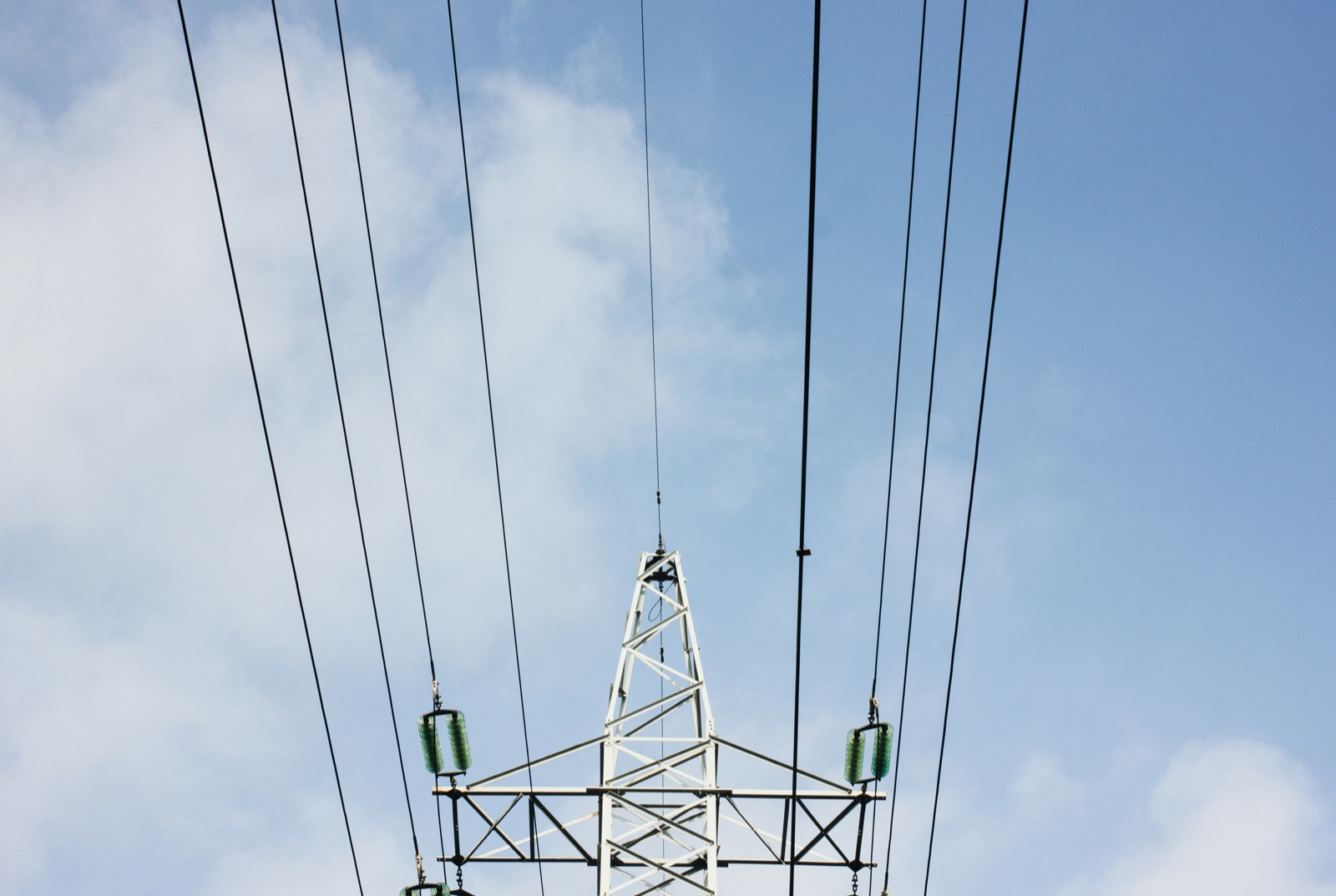Electrical power transmission tower with ceramic insulators for Pyra-Sil™ silicone conformal coating aerospace defense